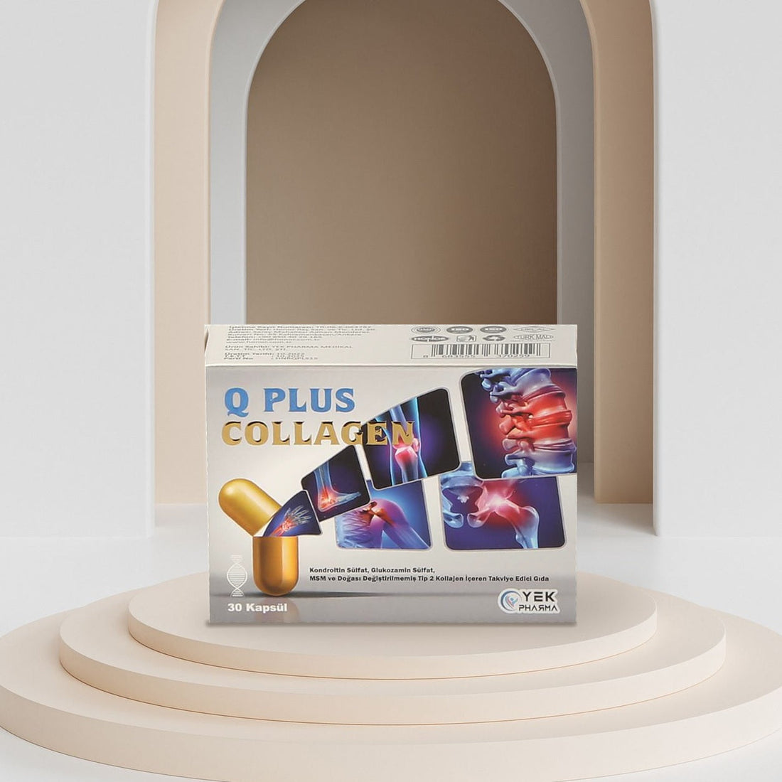 Q Plus Collagen 30 kapsül kutusu bej podyum üzerinde