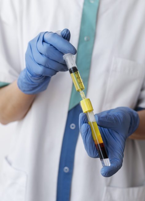 doctor-holding-injection-vial-front-view